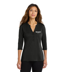 Woman wearing a black long-sleeve shirt with a logo on a white background